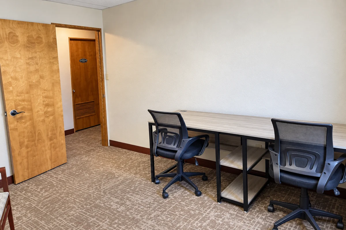 furnished private office suite 203 with desk and office chair